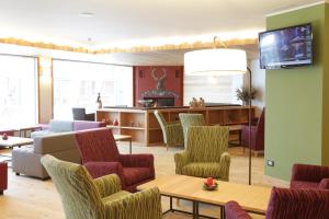 TV a/nebo společenská místnost v ubytování Hotel Delle Alpi