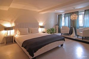 Postel nebo postele na pokoji v ubytování Elements Hotel