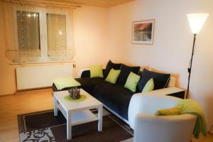 a living room with a couch and a table at Ferienhaus Voss in Alt Zauche +16 photos
