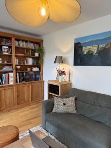a living room with a couch and a table at Bienvenue au 24 in Le Havre