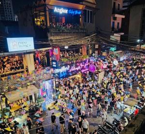 an overhead view of a crowd of people at an event at Times Hotel at Bassac Lane in Phnom Penh +52 photos