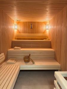 a sauna with a basket in the middle of it at Residenz Bollwark 3 1 in Olpenitz