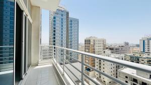 a balcony with a view of a city at Ginger Luxury House in Juffair