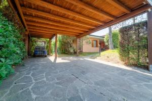 an outdoor patio with a wooden pergola at April in Caleri