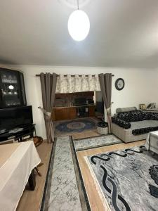 a large living room with a bed and a television at Suc Valley in Klos +6 photos