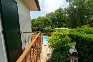 a view of a pool from the balcony of a house at D Oro in Caleri