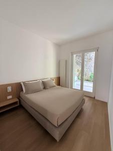 a bedroom with a large bed and a window at Adagio Ravello in Ravello +61 photos