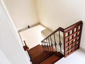 an overhead view of a wooden staircase in a house at Princess Rose Villa in Vavuniya +1 photo