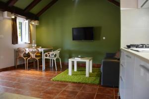 a living room with a table and a couch at Holiday Home Sweet Dreams in Pučišća