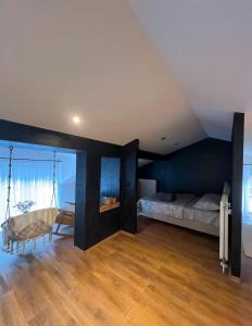a bedroom with a bed and a swing at Forest home in Konjic +14 photos