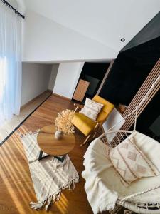 a living room with a table and a couch at Forest home in Konjic