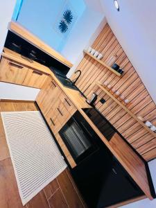 an overhead view of a kitchen with wooden cabinets at Forest home in Konjic