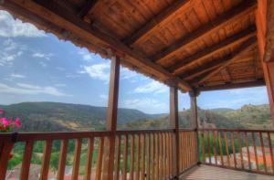 a balcony with a view of the mountains at La Posada De Santa Ana in Tramacastilla +10 photos