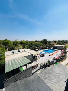 an overhead view of a resort with a swimming pool at Palm Galaxy in Itimādpur