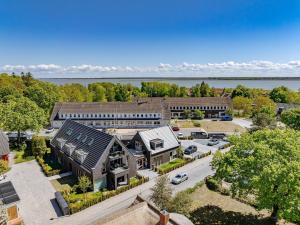 an aerial view of a building with a parking lot at Ferienwohnung Boddenschnacker in Born +19 photos