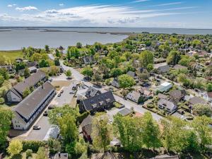 an aerial view of a town with a lake at Ferienwohnung To Huus in Born