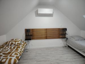 a bedroom with a bed and a window in it at Jauxvial 2 in Jaux