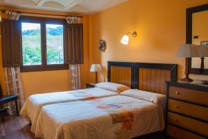 Ein Bett oder Betten in einem Zimmer der Unterkunft Casa Rural Acebal