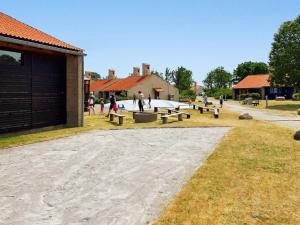 a group of benches in a park with a skate park at 6 person holiday home on a holiday park in Sæby in Sæby