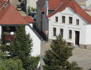 an overhead view of a white house with christmas trees at Ferienhaus am Mühlenteich in Teterow