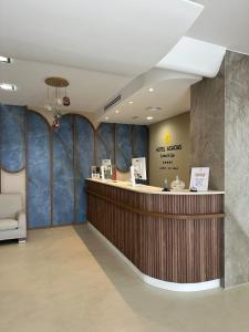 a lobby of a hotel with a reception counter at Hotel Acacias Suites & Spa in Lloret de Mar +70 photos