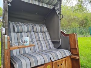 a bed in a tent with a cup in it at Haus Atlantis am Edersee in Bringhausen