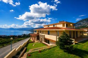 a house on the side of a road at Hotel Villa Gustui Maris in Cala Gonone