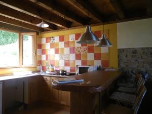 a kitchen with a sink and a counter top at Casa Azul Rodiles in Selorio