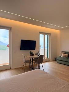 a bedroom with a table and chairs and a couch at Adagio Ravello in Ravello