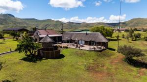 an aerial view of a house in a field at De Ark Mountain Lodge in Clarens