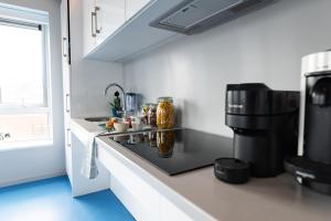 a kitchen with a counter with a coffee maker at Stephen's Quarter - Aparto in Dublin