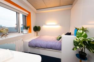 a bedroom with a bed and a window at Stephen's Quarter - Aparto in Dublin +13 photos