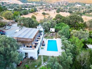 an aerial view of a house with a swimming pool at Alya Hill Bodrum in Bodrum City