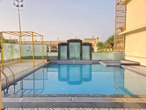 a swimming pool on the roof of a building at Pink Mahal Hotel & Resort in Jaipur