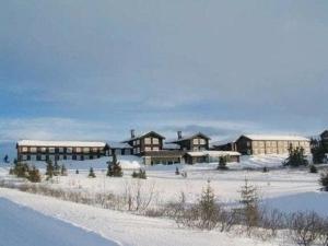 a group of buildings in the snow at Hafjell apartment, Ilsetra in Øyer