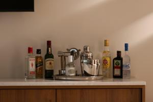 a counter with many bottles of alcohol on it at Maritima Villas in Paliouri