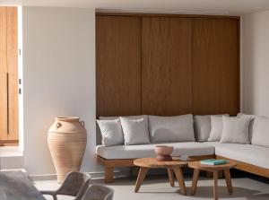 a living room with a couch and a table at Maritima Villas in Paliouri +28 photos