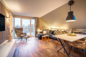 a living room with a couch and a table at Riff5 Wohnung 6 in Borkum