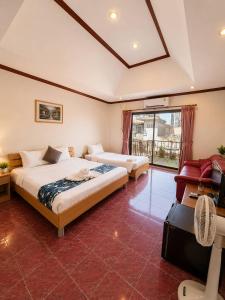 a large bedroom with two beds and a window at the L Hua Hin in Hua Hin +61 photos