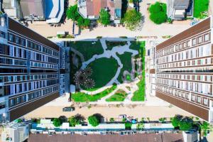 an aerial view of a courtyard between two buildings at Cara Riverside Cần Thơ- 2 mins GO Cần Thơ in Can Tho +1 photo