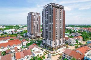 an aerial view of two tall buildings in a city at Cara Riverside Cần Thơ- 2 mins GO Cần Thơ in Can Tho