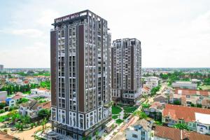 an overhead view of a tall building in a city at Cara Riverside Cần Thơ- 2 mins GO Cần Thơ in Can Tho
