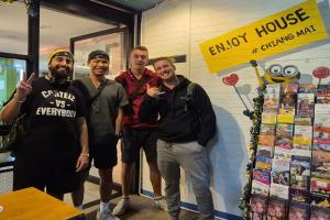 a group of men standing in front of a store at Lazy Gibbon 1 Chiang Mai - Tha Phae Gate in Chiang Mai +56 photos