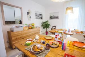 a kitchen with a wooden table with food on it at Il Gallo Con Gli Stivali in Termoli