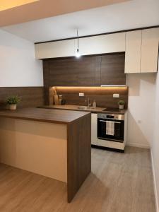 a kitchen with a counter top and a stove at Cozy aparment Susanj,Bar in Bar