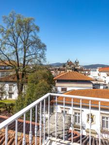 a view of a city from the balcony of a building at Collector's Home in Braga