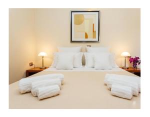 a bedroom with two white pillows on a bed at Villa Sunset B&B/Apartments in Fontane Bianche