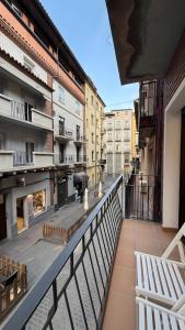 an apartment balcony with a view of a courtyard at Rincón Mudejar in Teruel