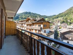 a balcony with a view of a city at Appartement au cœur de La Clusaz, animaux acceptés - FR-1-304-7 in La Clusaz