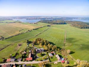 an aerial view of a farm with a lake at Gutshaus Wohnung 6 in Laschendorf